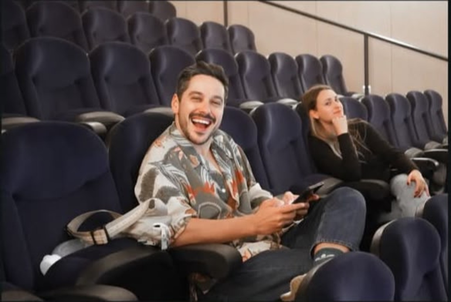 Marco smiling in the theatre auditorium between rehearsals